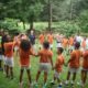 Kids standing in a circle to do an activity at Camp Dogwood